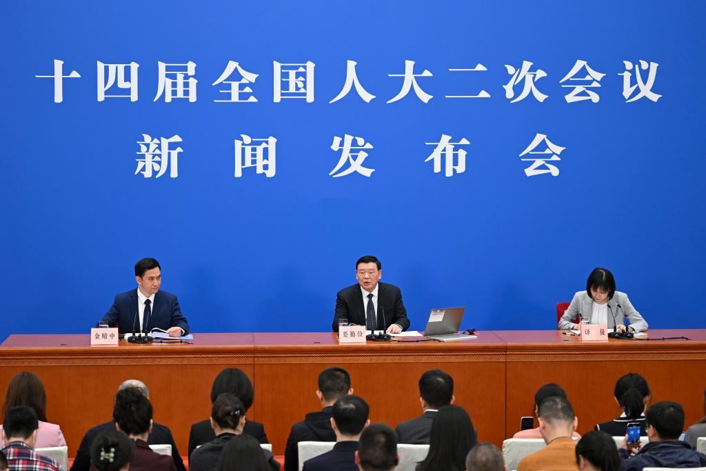 3月4日，十四屆全國人大二次會議在北京人民大會堂舉行新聞發(fā)布會。大會發(fā)言人婁勤儉就大會議程和人大工作相關(guān)問題回答中外記者的提問。 新華社記者 牟宇 攝
